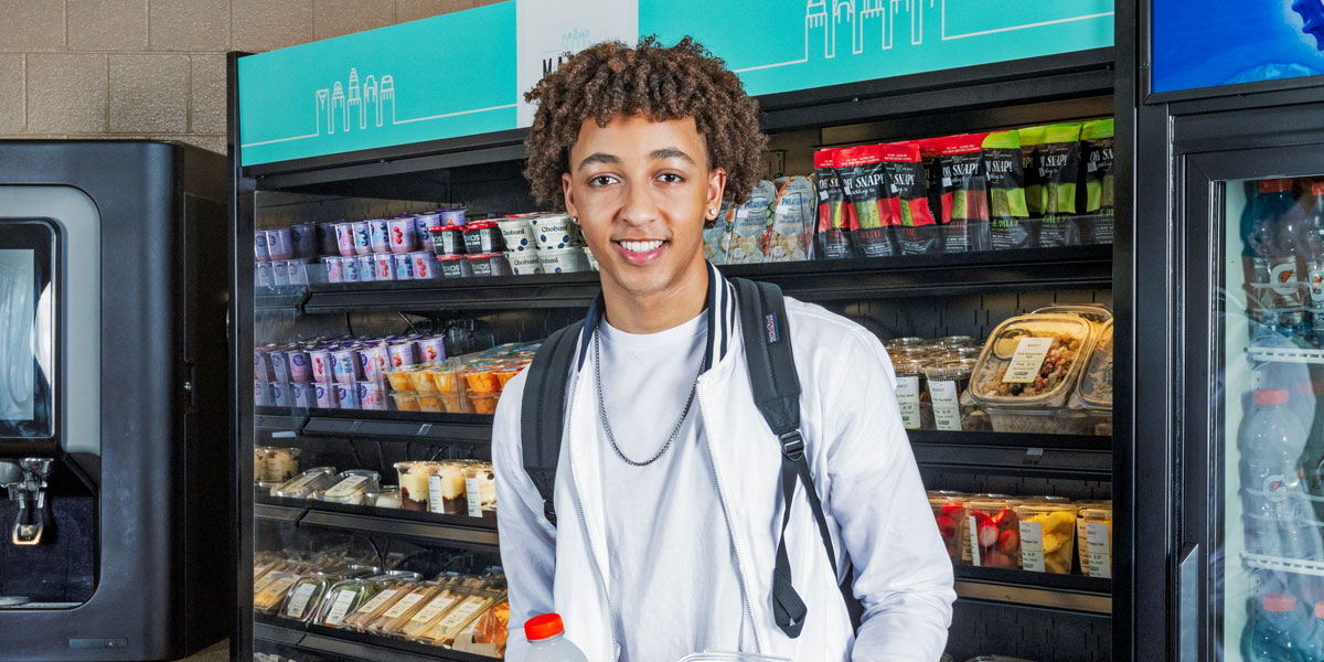 Student standing in market